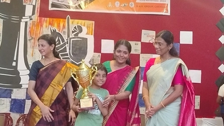 Chess tournament winners celebrating their success at an event in Chennai.