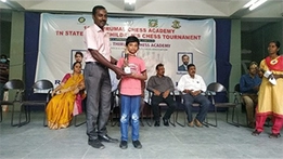 Young players celebrating their chess achievements after tournament success.