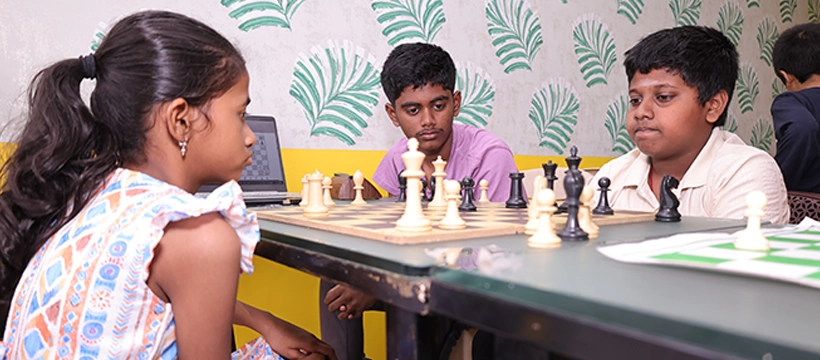 Students learning chess strategies through structured coaching sessions at Time2Chess Chennai.